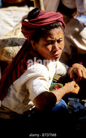 Traditionally dressed Burmese people and vendors at market on Inle Lake Shan State Burma Myanmar Stock Photo