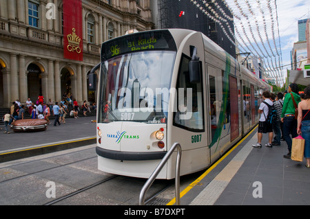 A Melbourne tram picking up passengers in the central city