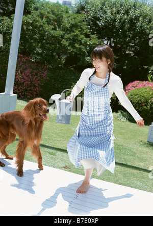 Woman playing with dog Stock Photo