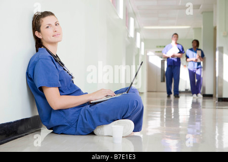 A female doctor on her laptop Stock Photo