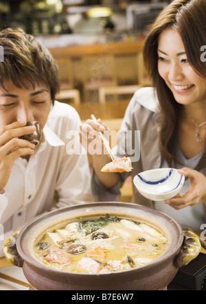 Couple Eating Japanese  Style Chowder Stock Photo