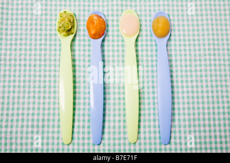 Baby food on spoons Stock Photo