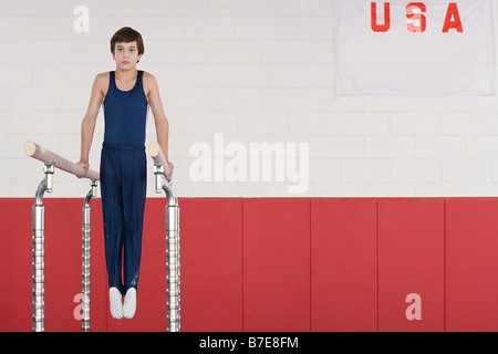 Gymnast on parallel bars Stock Photo