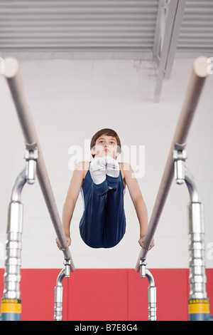 Gymnast on parallel bars Stock Photo