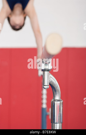 Gymnast on parallel bars Stock Photo
