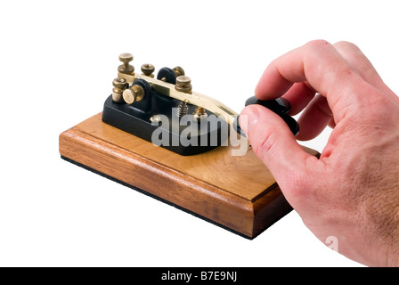 Man operating a Morse code key isolated on white background Stock Photo