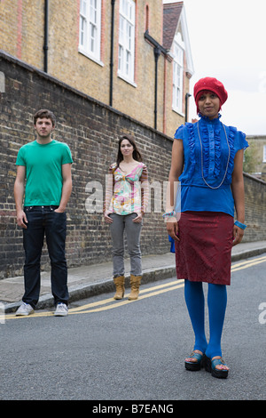 Young people standing in street Stock Photo