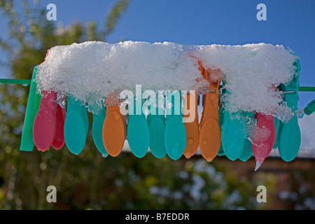 Washing pegs in the frost Stock Photo