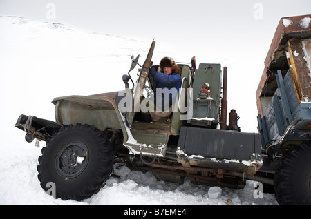 Truck with driver, carrying food and fuel, Chukotka Siberia Russia Stock Photo