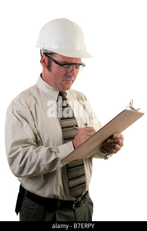 a construction safety inspector with safety goggles and a hard hat inspecting a jobsite Stock Photo
