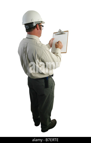 A construction safety inspector marking his checklist full over the shoulder view Stock Photo