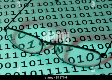 Eyeglasses on blue binary background Stock Photo