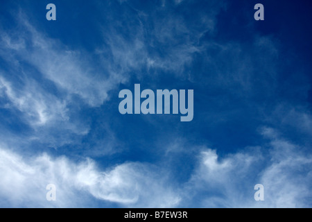 wispy white streaky cirrus clouds with a blue sky behind them Stock ...