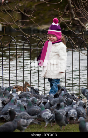 young girl with pigeons in St Stephen's Green, Dublin, Ireland Stock Photo