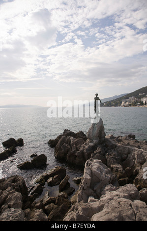 'Maiden with the seagull', statue of girl looking out to sea on promontory at Opatija, Croatia Stock Photo