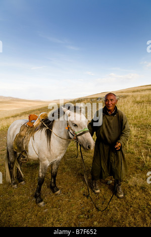 A local Mongolian herdsman on his horse Stock Photo - Alamy