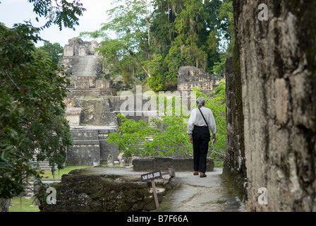 Tourist exploring the Mayan ruins around  the 'Grand Plaza' of Tikal, Guatemala. Stock Photo