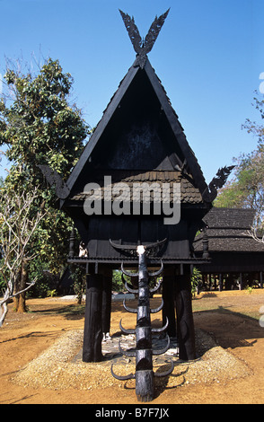Thai Raised Granary and Notched Trunk Ladder with Horns, by Thai Artist Tawan Dachanee, Chiang Rai, Thailand Stock Photo
