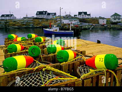 Peggy's Cove Nova Scotia Canada with colorful buoys on a wharf Stock Photo