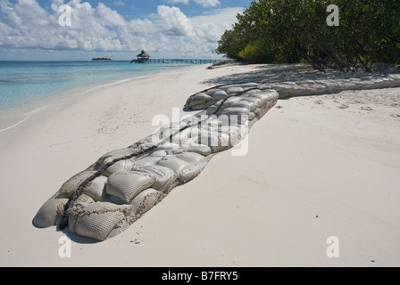 Sandbags used as a form of coastal defense to prevent the erosion of a an island in the Maldives. Stock Photo