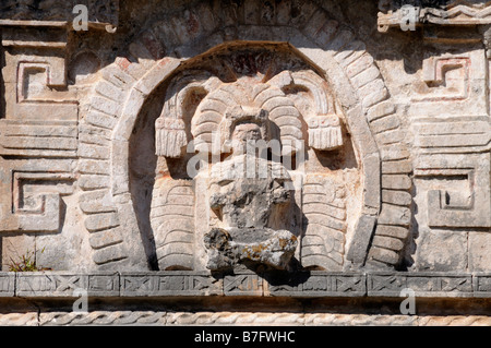 Figure of a god wearing rich headdress of feathers above doorway to Annex, Chichen Itza Stock Photo