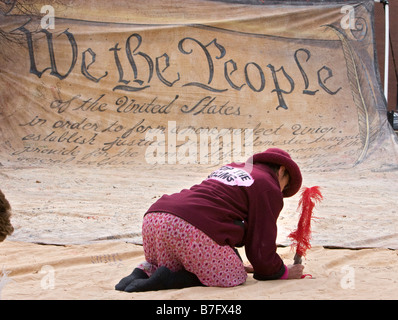Woman Signs Name to Replica of Preamble to US Constitution Stock Photo