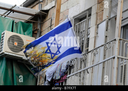 Half burnt Israeli flag in the ultra-orthodox Jewish neighbourhood of Mea Sharim in Jerusalem. Stock Photo