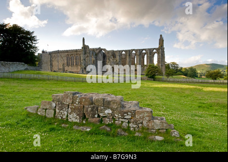 Summer view from south of ancient, picturesque monastic ruins of Bolton Abbey & priory church, in scenic countryside - Yorkshire Dales, England, UK.