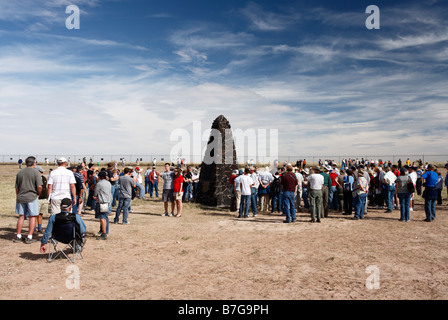 Sightseers gather around the obelisk at Trinity Site, New Mexico, marking the site of the world's first atomic explosion. Stock Photo