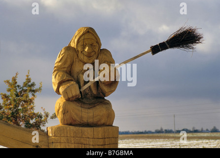 Wooden Baba Yaga sculpture at park near windmill in Seduva Lithuania Stock Photo