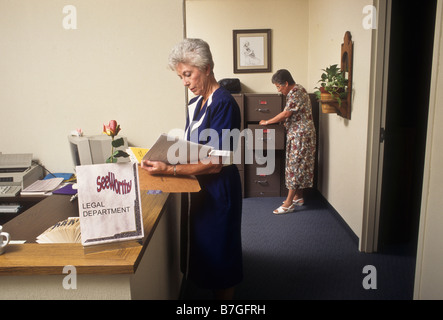 Two women work in law office employee worker staff busy responsible co-worker Stock Photo