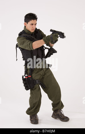 SAS or SWAT team member pointing a pistol Stock Photo