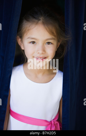 Young Asian flower girl smiling