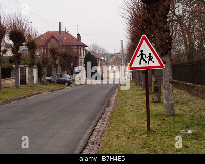 Children Crossing sign in the village of Precy sur Oise in France Jan 2009 Stock Photo