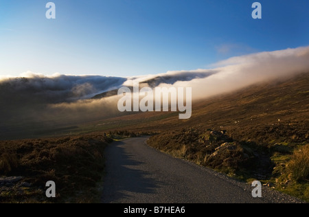 Mountain Road, Low Cloud Hugging the Comeragh Mountain Peaks, Near The Mahon Falls, County Waterford, Ireland Stock Photo