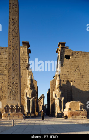 Luxor Temple, Luxor, Egypt. First Pylon with obelisk and colossi of Ramesses II Stock Photo