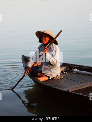 Vietnam, Mekong Delta, man steering boat on muddy canal Stock Photo - Alamy