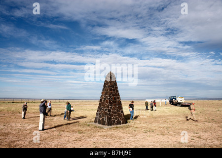 Sightseers visiting the obelisk marking the site of the world's first atomic bomb test which took place on July 16th, 1945. Trinity Site, New Mexico. Stock Photo