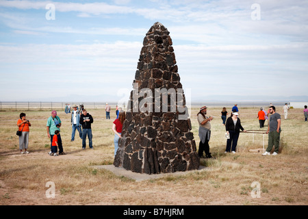 Sightseers gather around the obelisk marking the site of the world's first atomic explosion on July 16, 1945 at Trinity Site. New Mexico, USA. Stock Photo