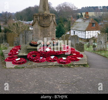 St Marys Church war memorial with Remembrance Day poppies. Westerham, Kent, England, UK. Stock Photo