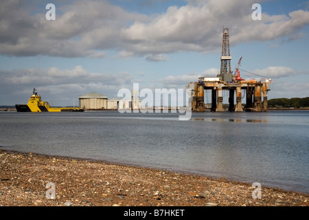 Oil rig Ocean Nomad being towed through the Cromarty Firth on the way to Invergordon Scotland Stock Photo