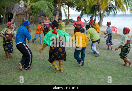 Local Kuna Indians practicing a traditional dance on Isla Pelikano San Blas Islands Panama Stock Photo