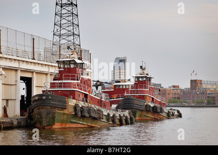 Tugboats moored at Fell s Point Baltimore Maryland Stock Photo
