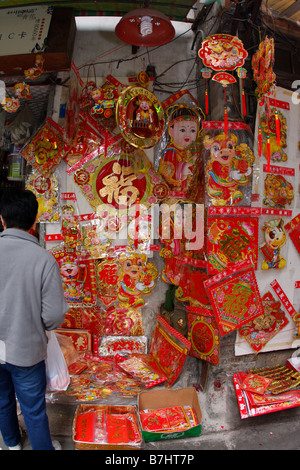 Chinese decrative New YEars items on sale in local residential street shop Stock Photo