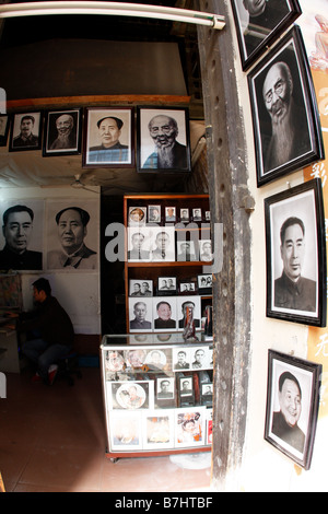 Young man has small business in China restoring old photos Stock Photo