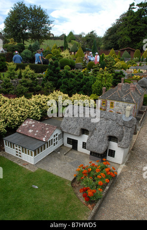 Visitors admiring the model village of Godshill at Godshill village on the Isle of Wight, Britain.  Godshill is a very picturesque and popular village Stock Photo