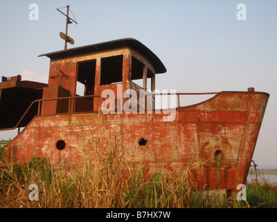 Rusting riverboat abandoned on the bank of the Congo River at Kongolo Katanga Province Democratic Republic of Congo Stock Photo