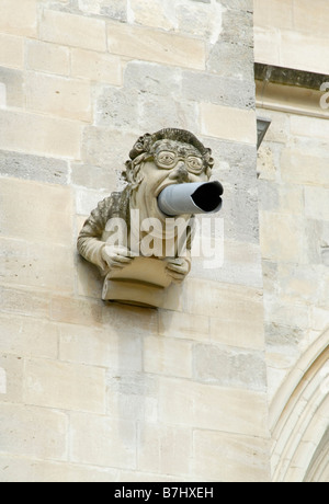 Modern gargoyle wearing glasses on south face of Chichester Cathedral, Chichester, West Sussex, England Stock Photo