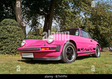 Pink Porsche 911 Carrera RS classic supercar attending a car gathering ...