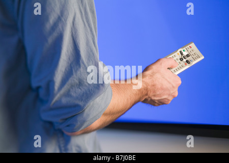 Channel changer and plasma TV, B.C. Stock Photo